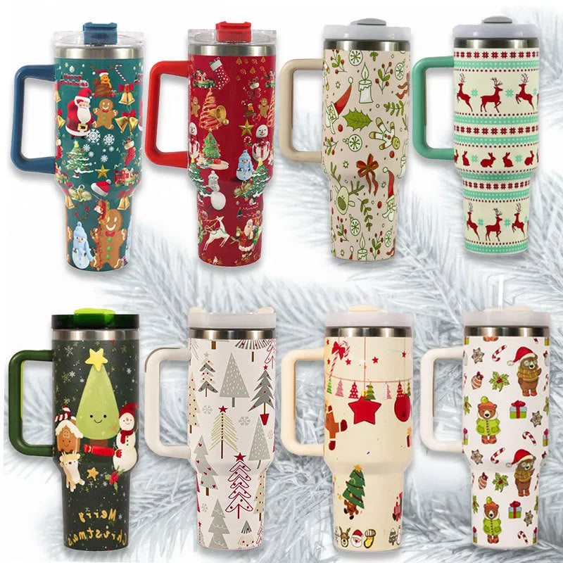 A large stainless steel travel mug with a handle, straw, and Christmas pattern, shown next to its leak-proof lid.