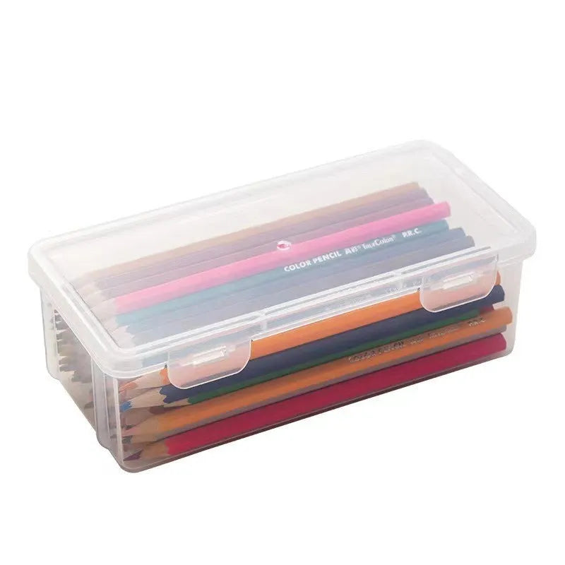 Transparent plastic stationery storage box with snap-lock lid containing coloured pencils and pens