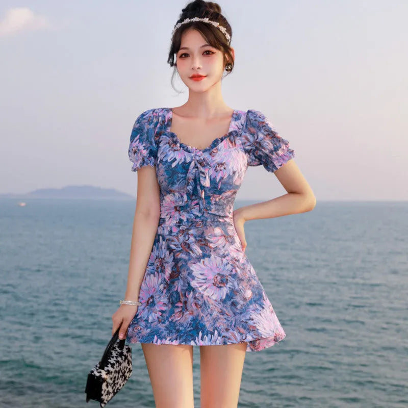 Women's solid colour one-piece swimsuit in polyester fabric available in blue, green, and yellow