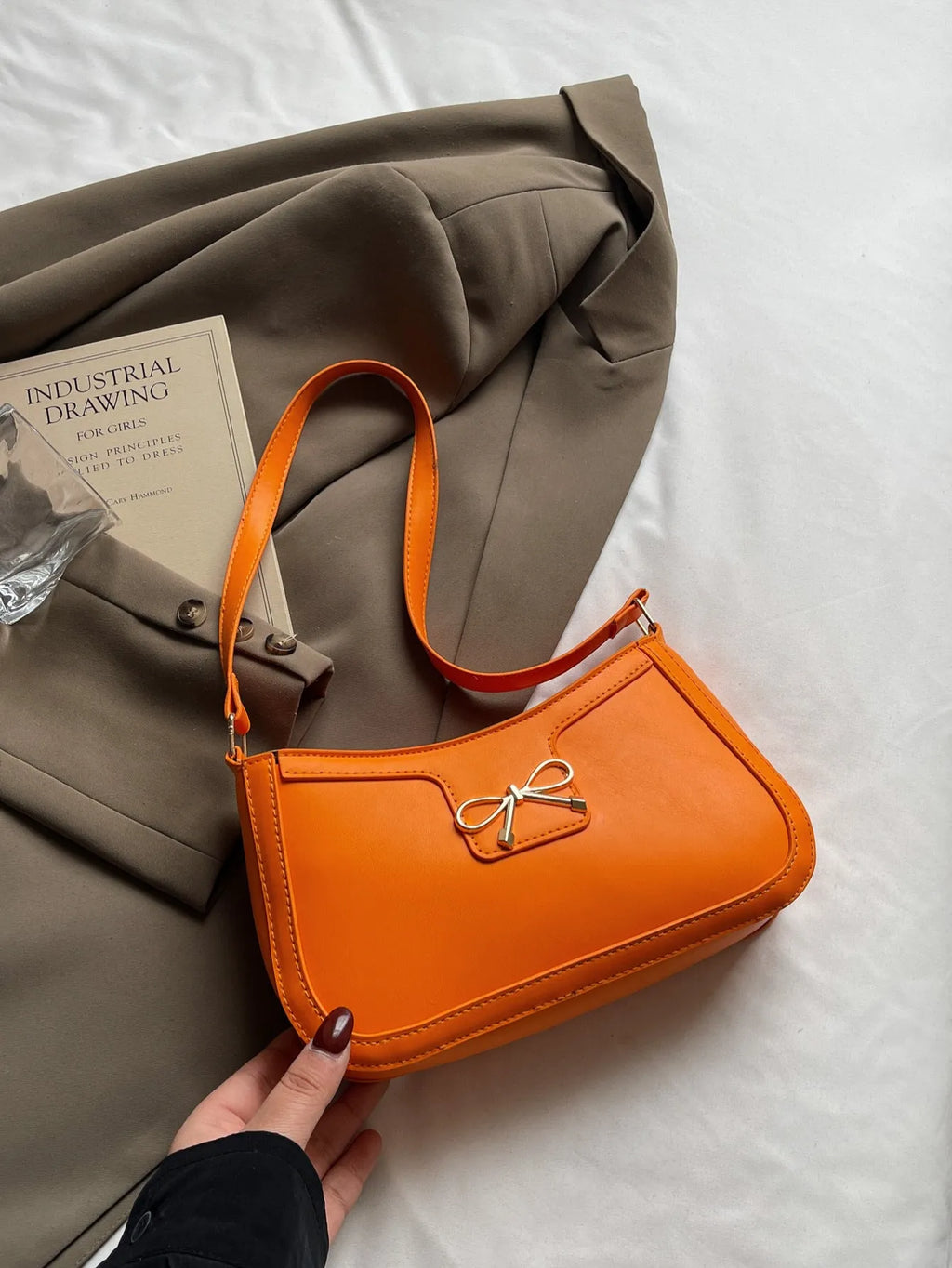 Horizontal square PU leather shoulder bag with a bow decoration, shown in multiple colours.