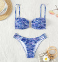 Women's floral high-waist bikini swimsuit set in solid blue colour with matching bra.