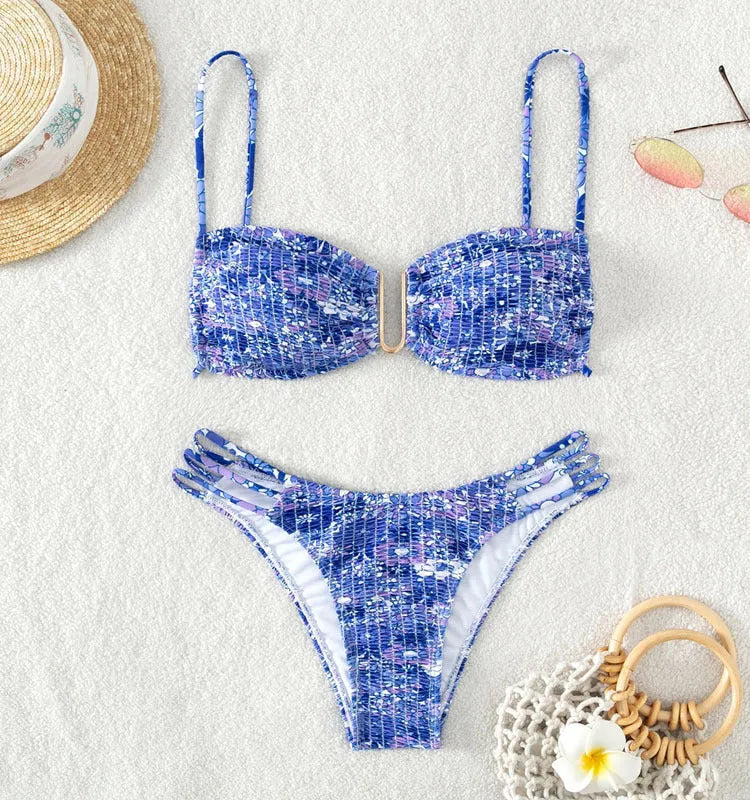 Women's floral high-waist bikini swimsuit set in solid blue colour with matching bra.