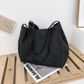Solid colour women's canvas handbag with double shoulder straps and large capacity design