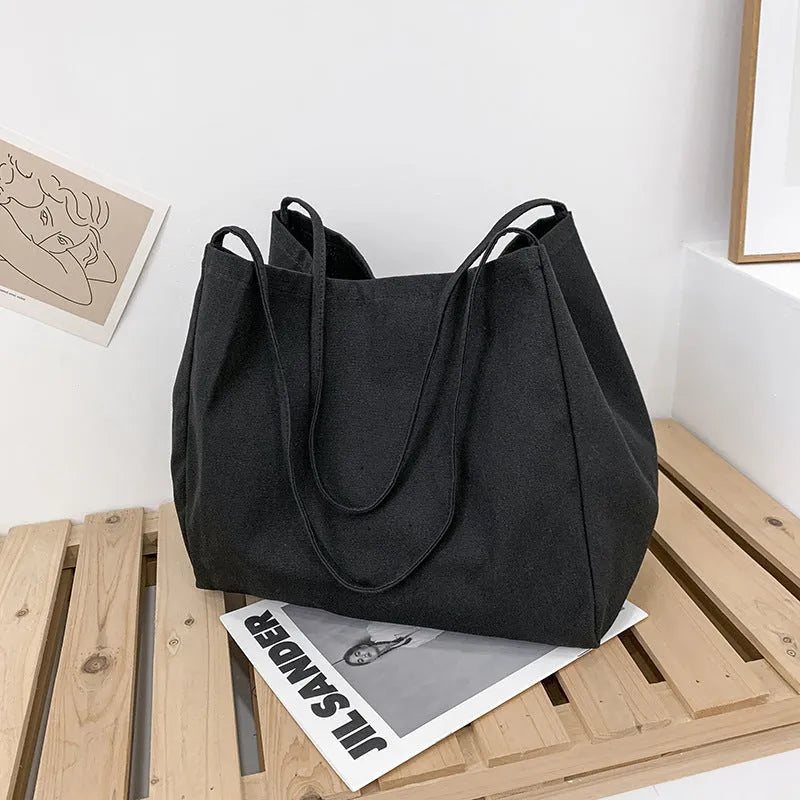 Solid colour women's canvas handbag with double shoulder straps and large capacity design
