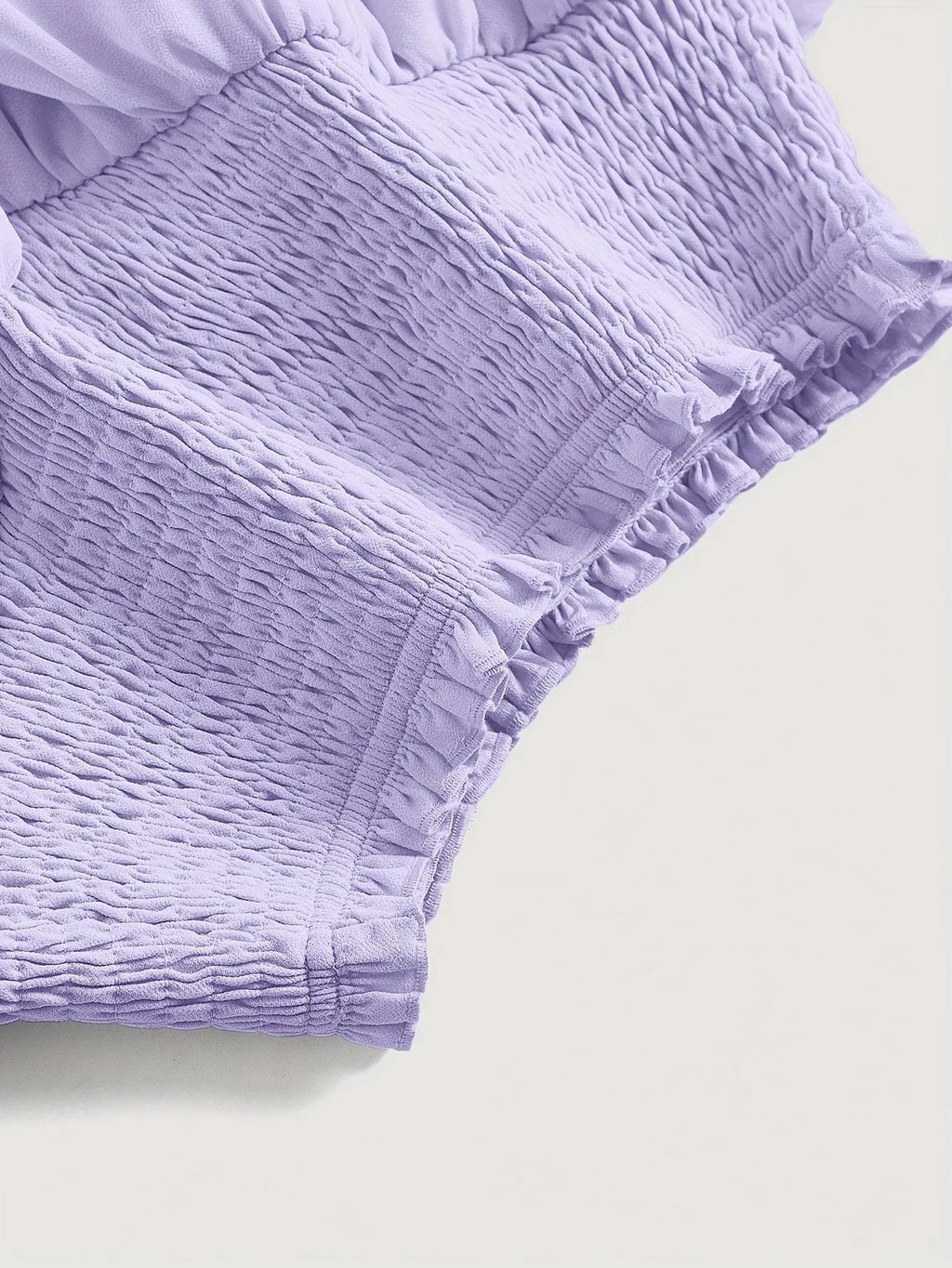 Puff short A-line skirt with high waist and ruffles, shown in purple or yellow, sizes S-XXL.