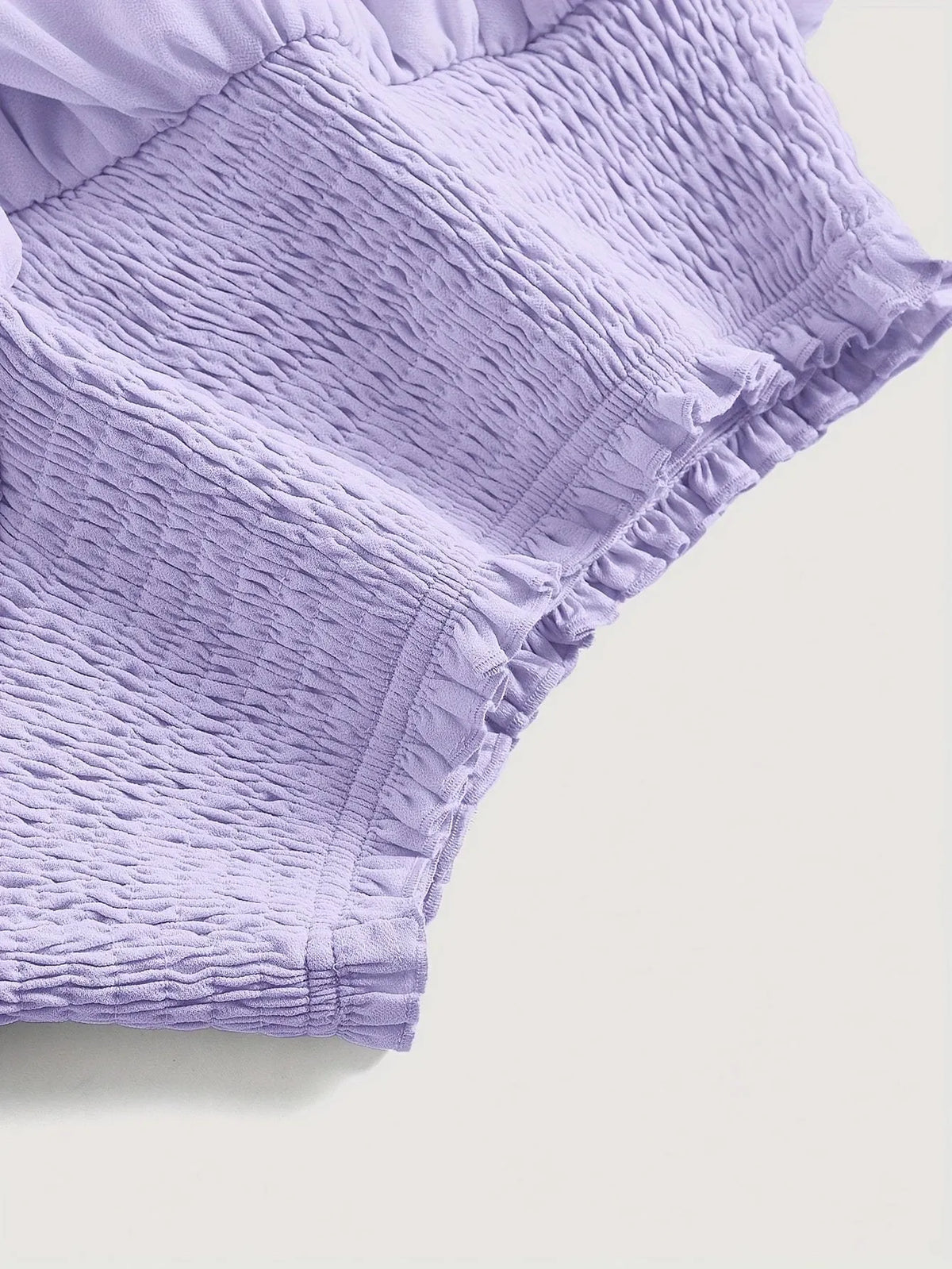 Puff short A-line skirt with high waist and ruffles, shown in purple or yellow, sizes S-XXL.