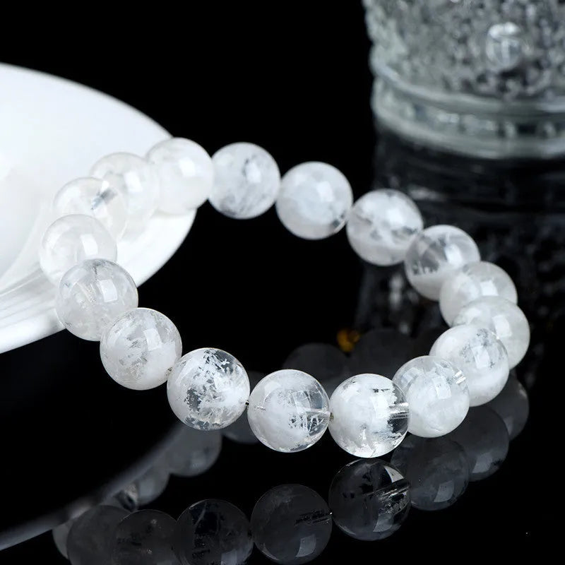 Natural blizzard crystal women's bracelet with round beads showing grinding treatment and geometric design