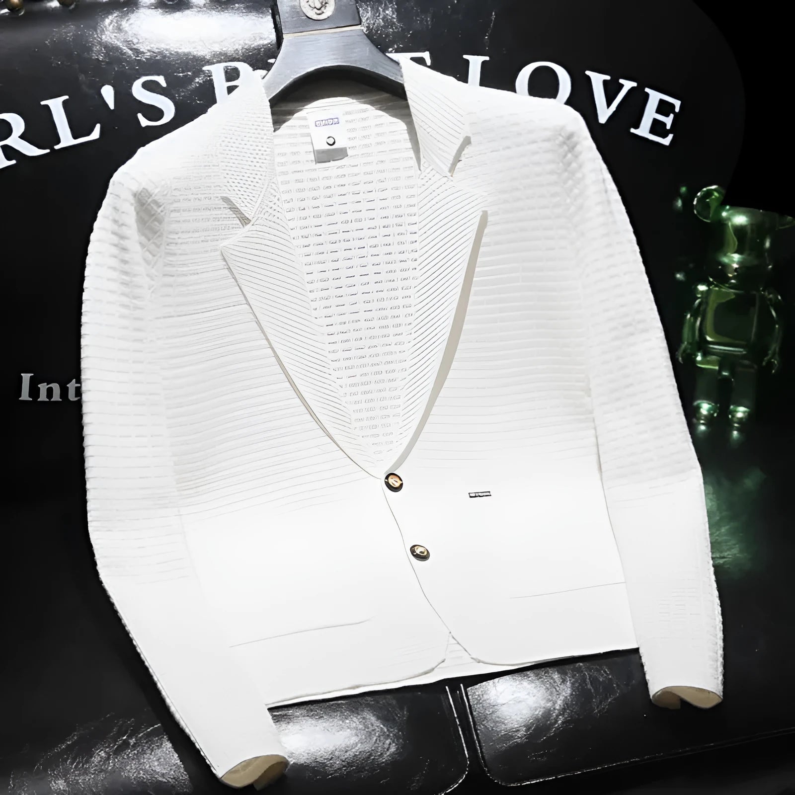 White men's thin V-neck suit jacket on a hanger showing front view with Asian sizing label