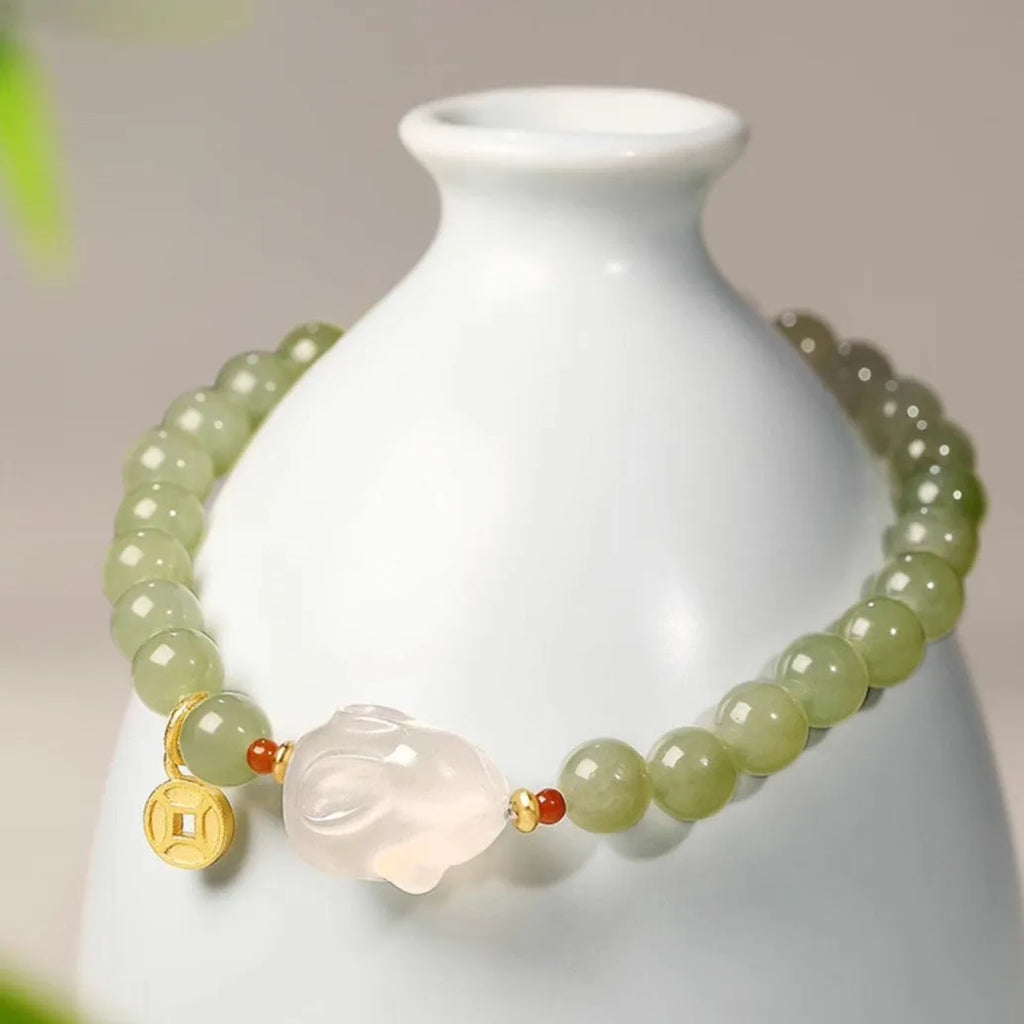 Handmade Hetian jade rabbit bracelet for women in glass, showing rabbit charm designs.