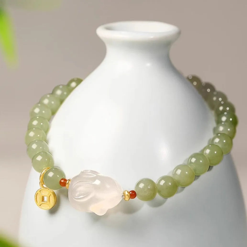 Handmade Hetian jade rabbit bracelet for women in glass, showing rabbit charm designs.