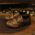 Men's light brown vintage engraved handmade distressed leather shoes with lace-up closure and round toe
