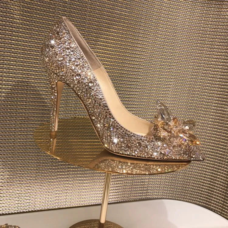Women's gold pointed toe high heels with rhinestones and sequins on a 7cm stiletto heel