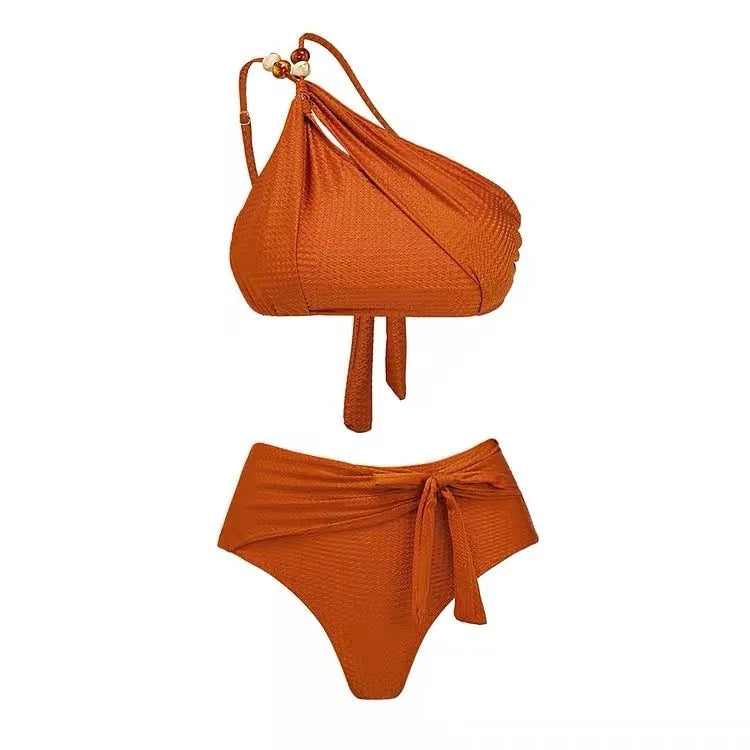 Brown high waisted women's push up bikini swimsuit with chiffon skirt overlay and split design.
