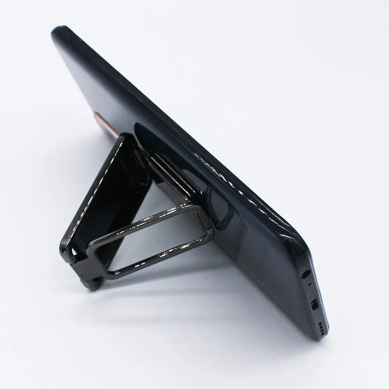 Foldable mobile phone holder with retractable ring buckle in zinc alloy, showing adjustable angle for devices
