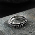 Geometric copper ring with triangle zircon inlay, shown in three metal colour options