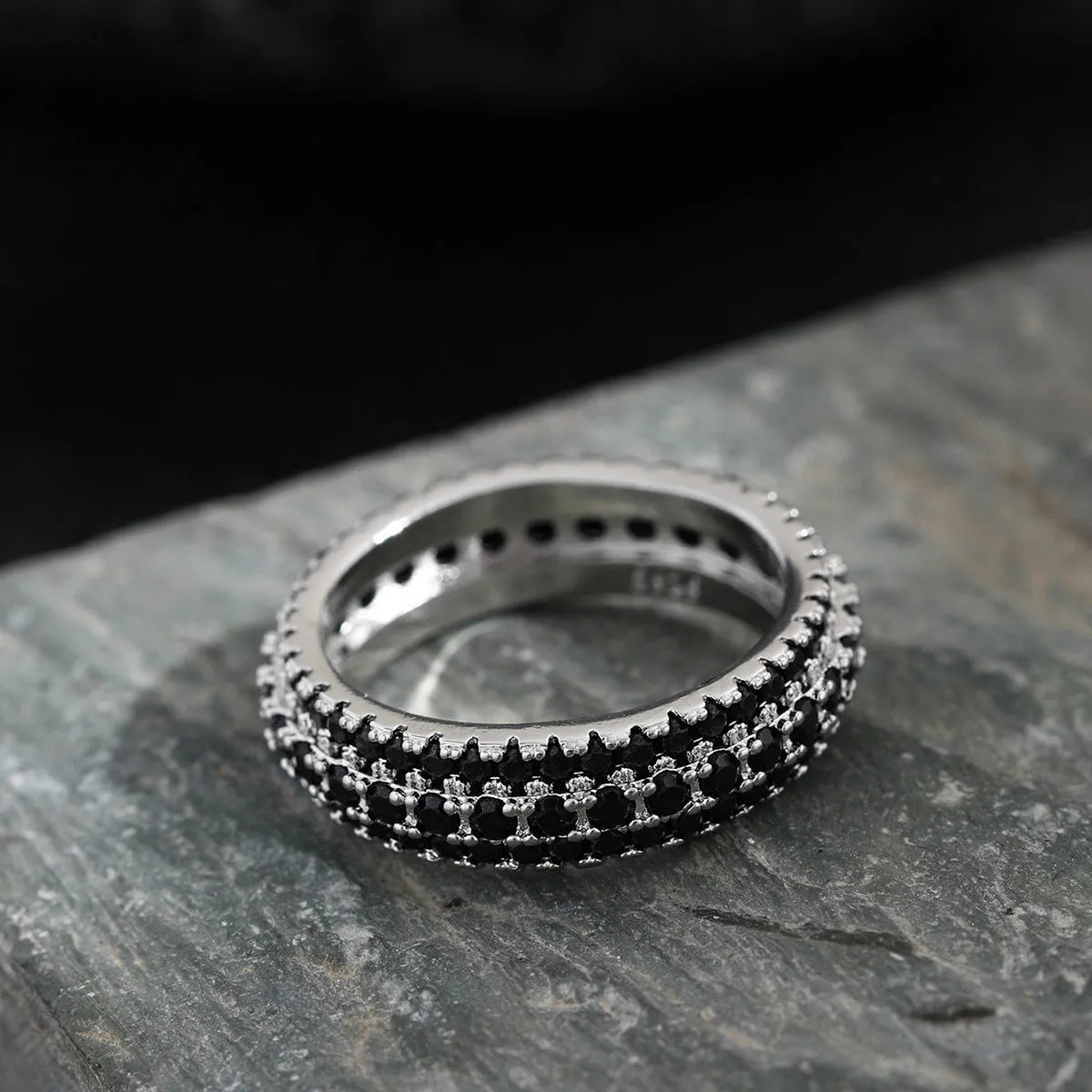 Geometric copper ring with triangle zircon inlay, shown in three metal colour options