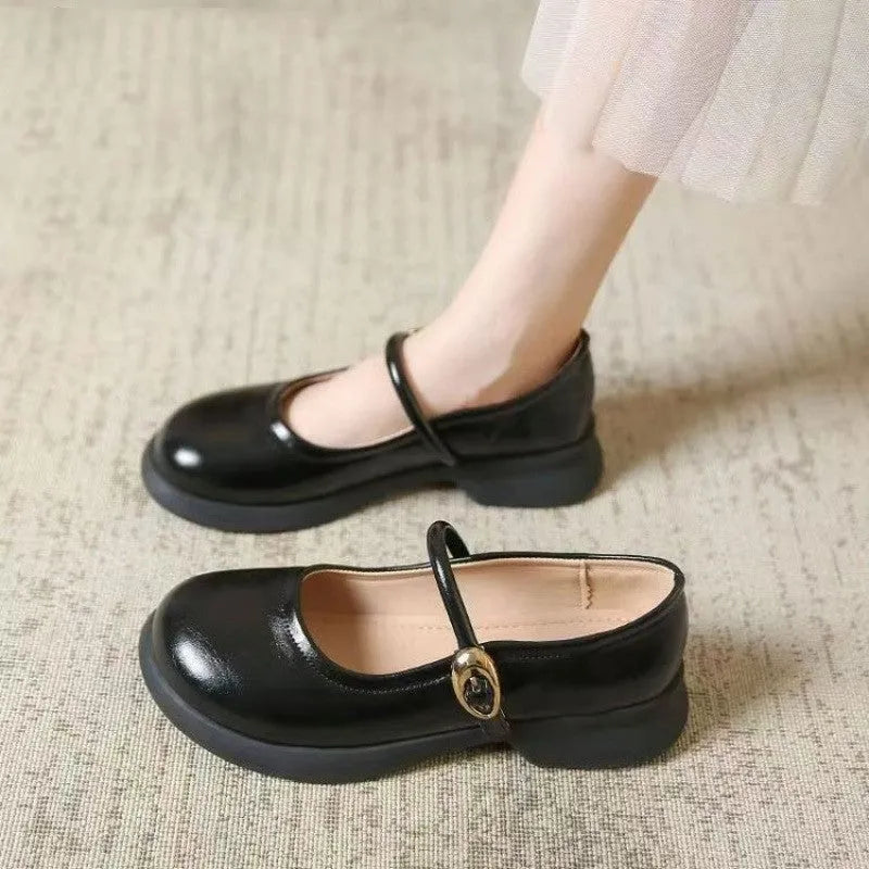 Black leather fairy style shoes with a skull pattern, round toe, and a 4-6cm wedge heel on a rubber sole.