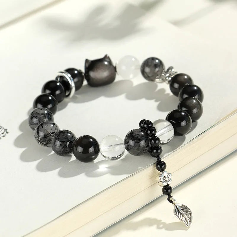 Silver stone bracelet with fox charm and pink, navy blue, black, snowflake ghost crystals.