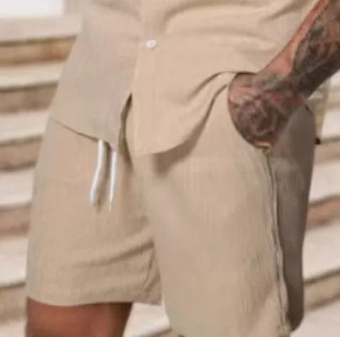 Men's striped printed casual suit set featuring a short sleeve shirt and matching shorts on a hanger.