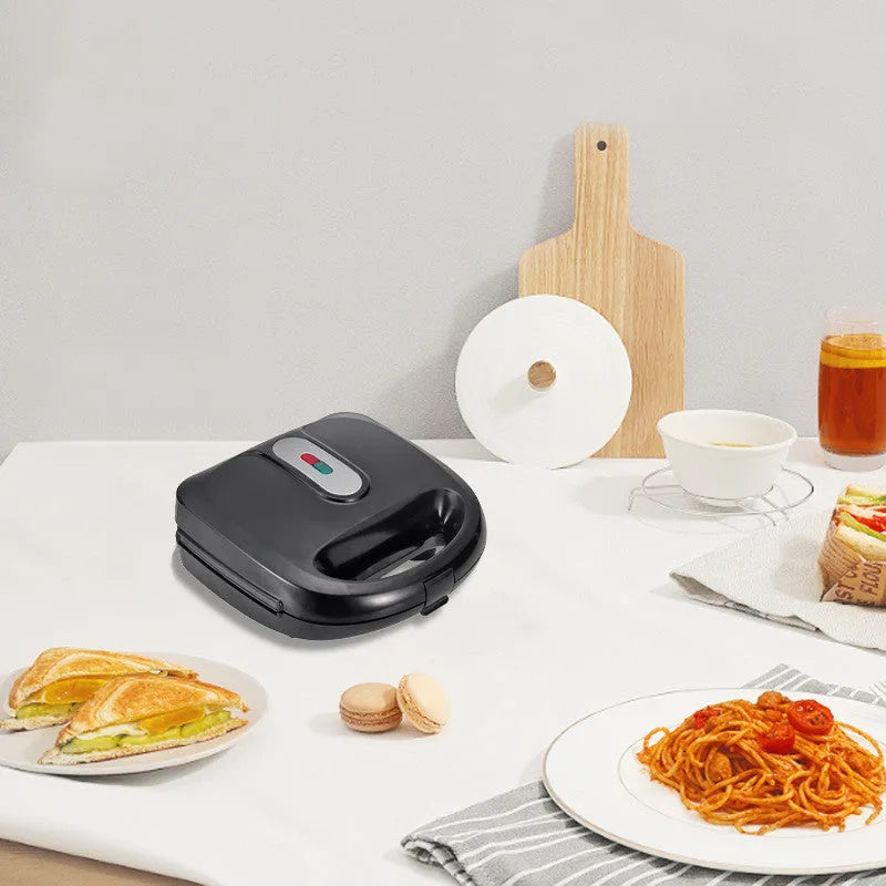 Black electric sandwich pan with double-sided heating, brushed stainless steel cover, and 29-31cm non-stick cooking surface