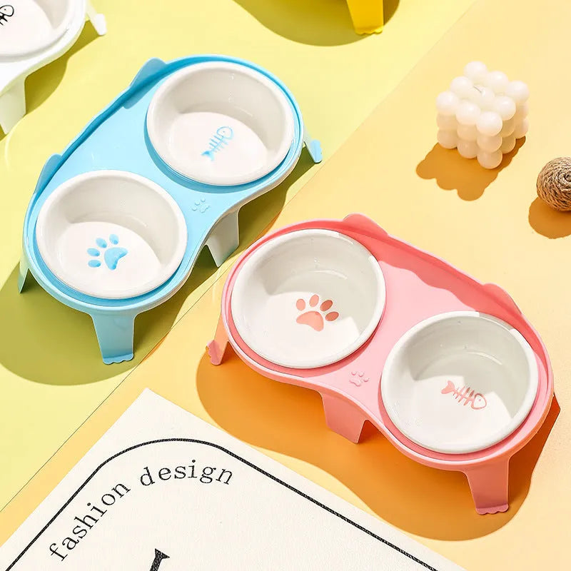 Ceramic cat food and water bowl set on elevated plastic stand with hook
