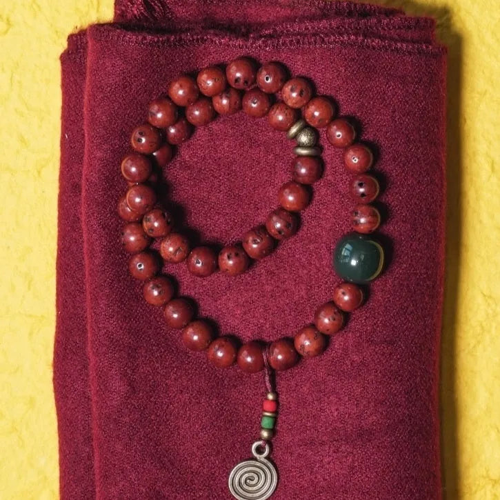 Bird's eye bodhi double circle bracelet showing hand-processed natural seeds in retro cartoon style