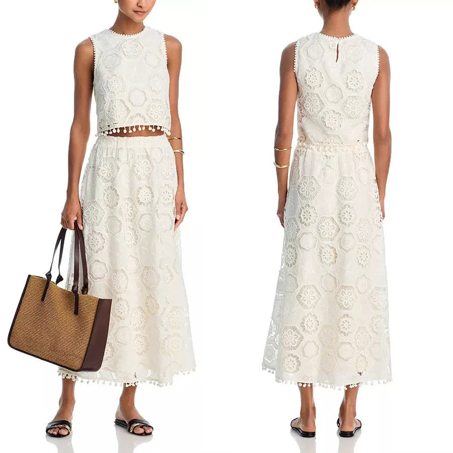 White women's suit with sleeveless top and long skirt featuring embroidery details in retro style