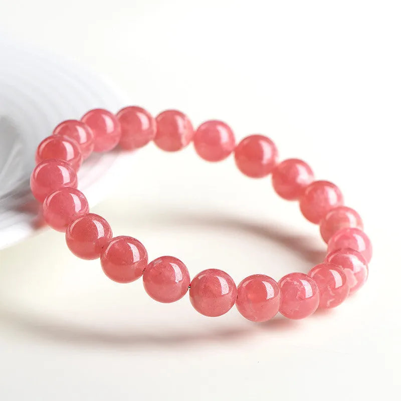 Women's natural red rhodochrosite crystal bracelet with geometric design and longevity lock fastening