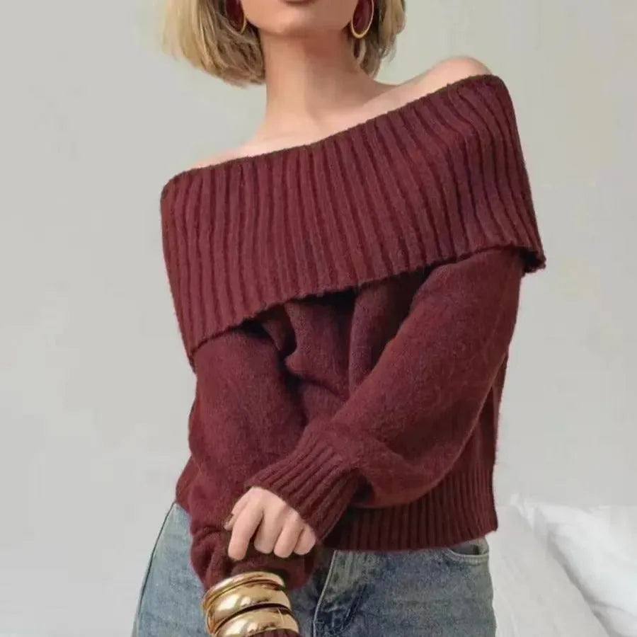 Off-the-shoulder grey sweater with 3D pattern and strapless design, showing regular sleeves and pullover style