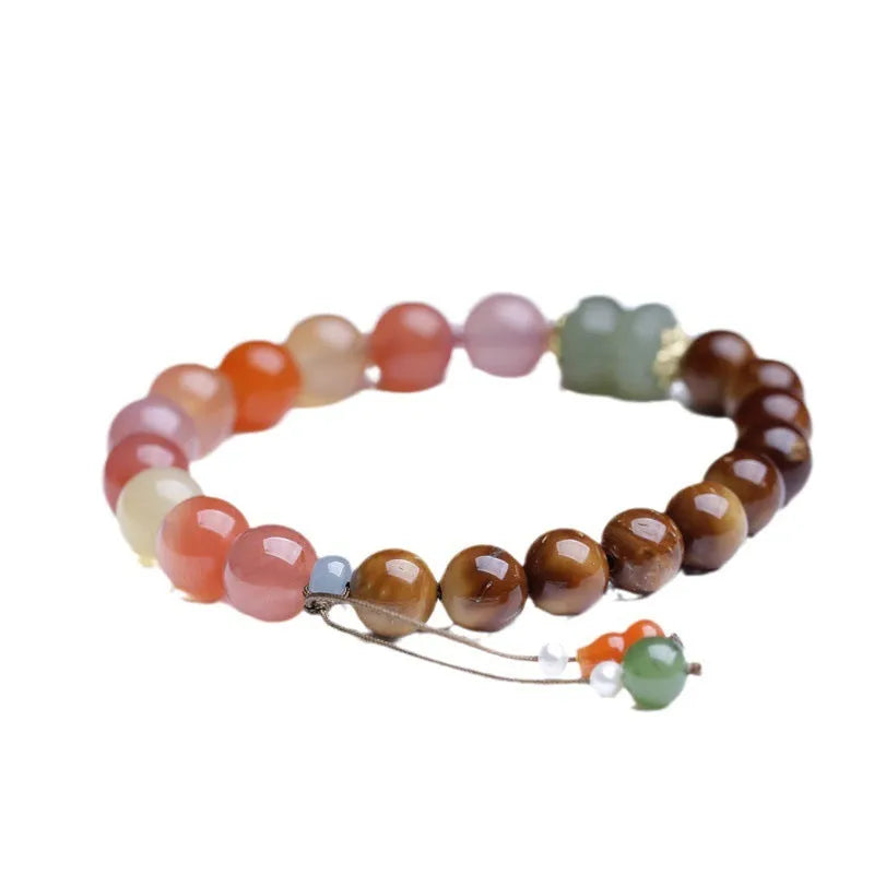 8mm agate bracelet with diamond-cut beads showing natural persimmon colour variations