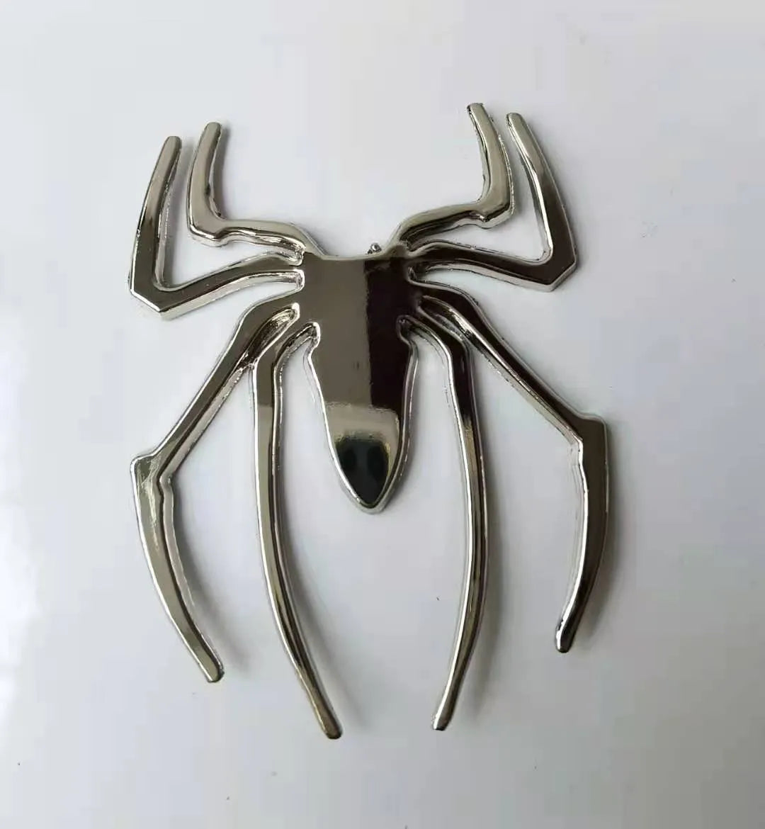 Three-dimensional metal spider bumper sticker showing raised design on zinc alloy with 7x5cm dimensions