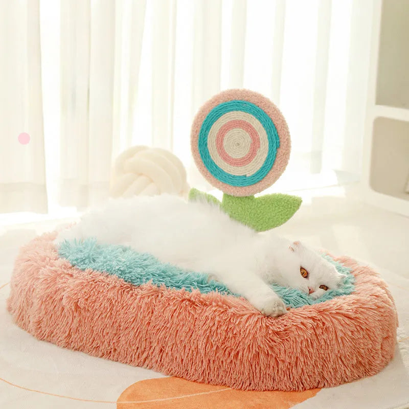 Pink elliptical lollipop shaped plush cat bed with raised sides, showing a removable cover.