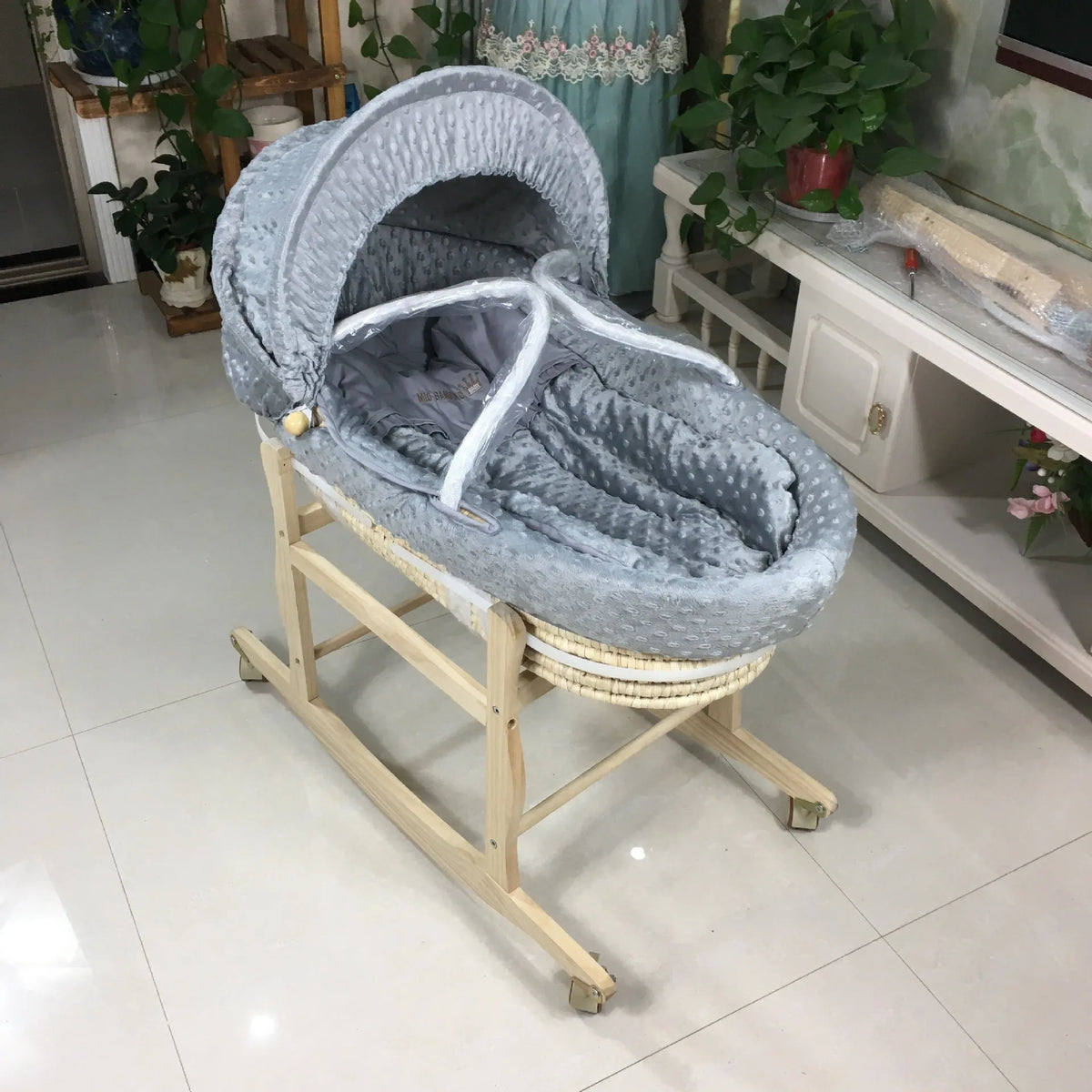 Portable multifunctional cradle bed with mosquito net and mat, in silver or white, with optional pine frame.