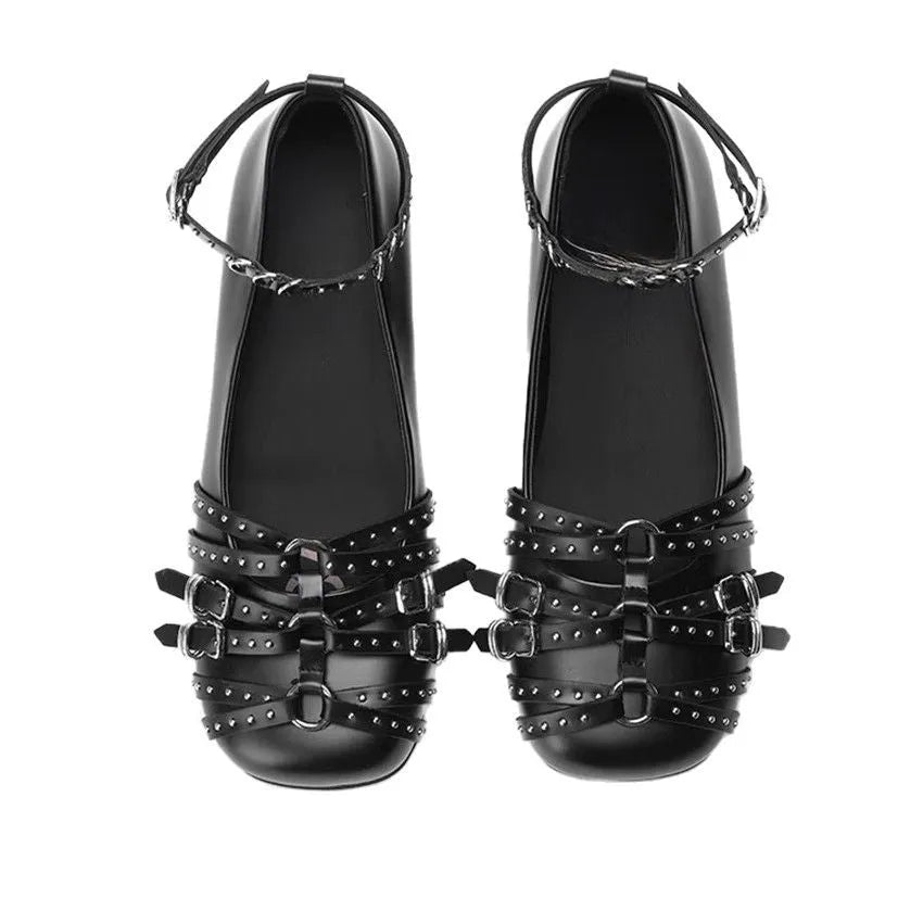 Women's black patent leather square-toe pumps with a buckle fastening and low flat heel.