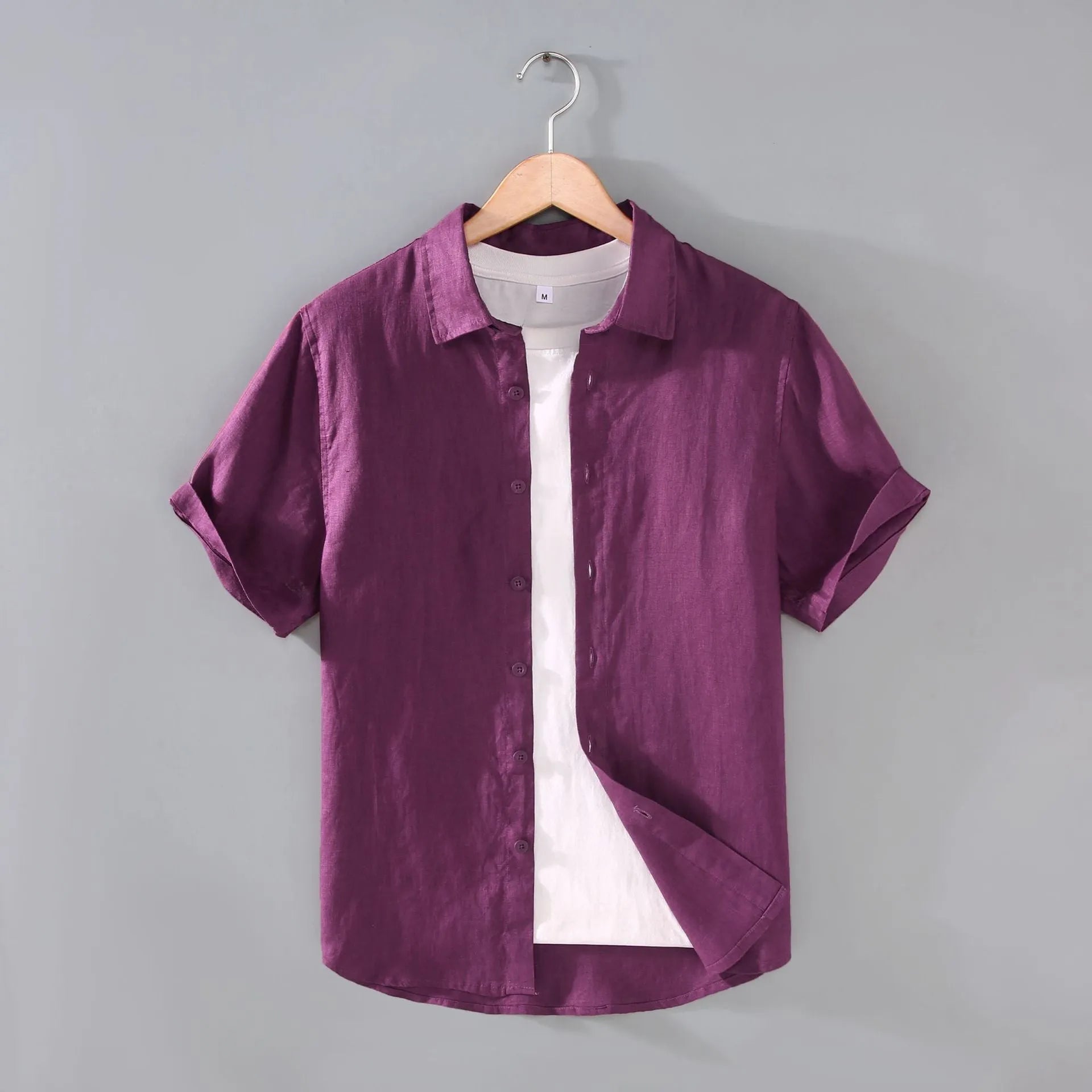 Men's grey linen short-sleeved casual shirt with a regular fit and cardigan style on a hanger