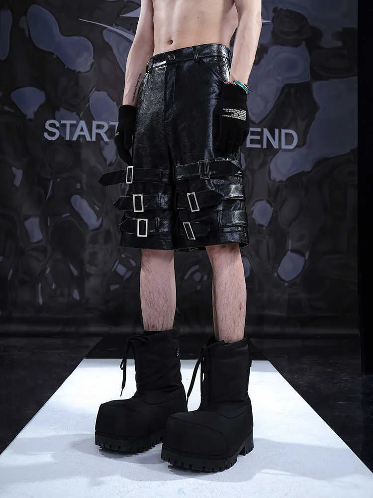 Men's black PU leather cropped shorts with medium-low waist, showing polycarbaminate fibre construction and contemporary design