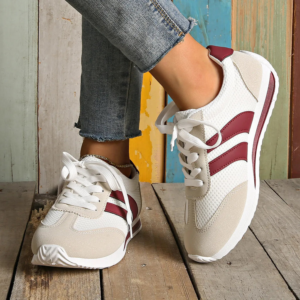 Wine red Cortez Retro low-top sneakers with cross-strap detail on synthetic leather upper.