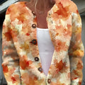 Yellow cardigan knitted coat with a raised 3D digital print pattern, shown on a hanger.