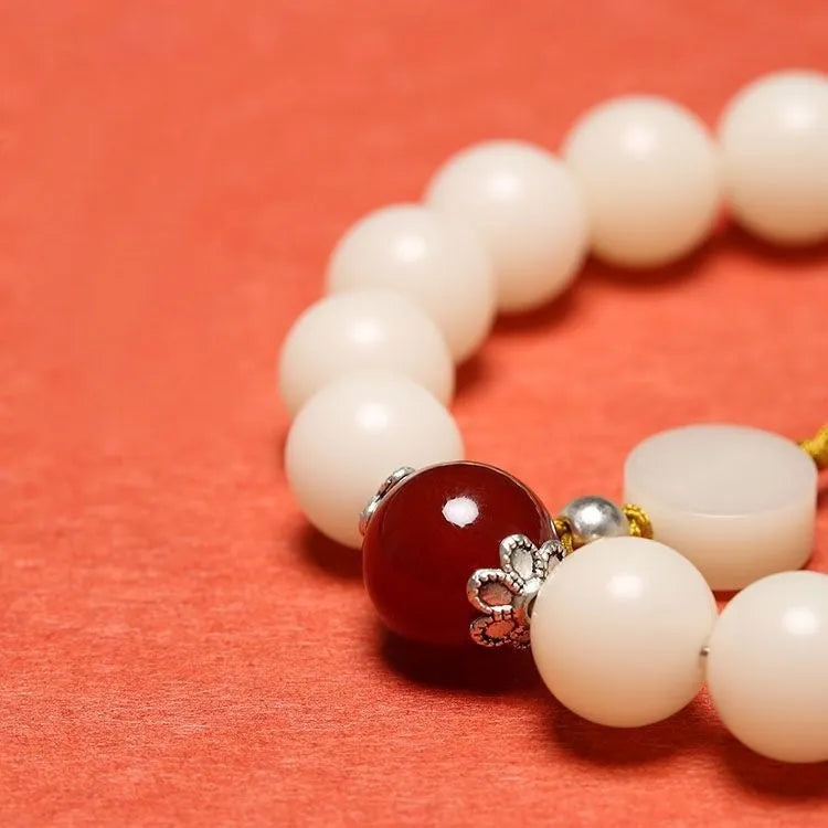 White Jade Bodhi bracelet with 10mm beads in three colour options showing manual processing details