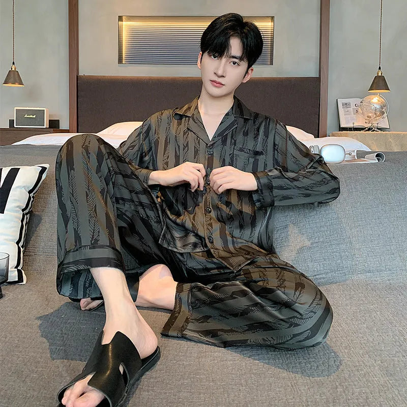 Men's black striped ice silk pajama two-piece set with V-neck top and long trousers.