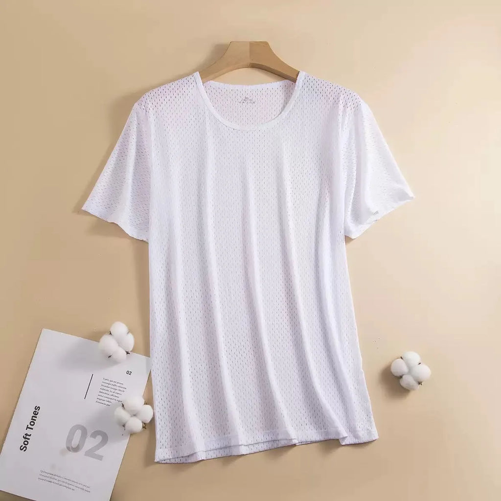 Man wearing a grey ice silk short sleeve t-shirt showing its loose fit and crew neck design for summer.