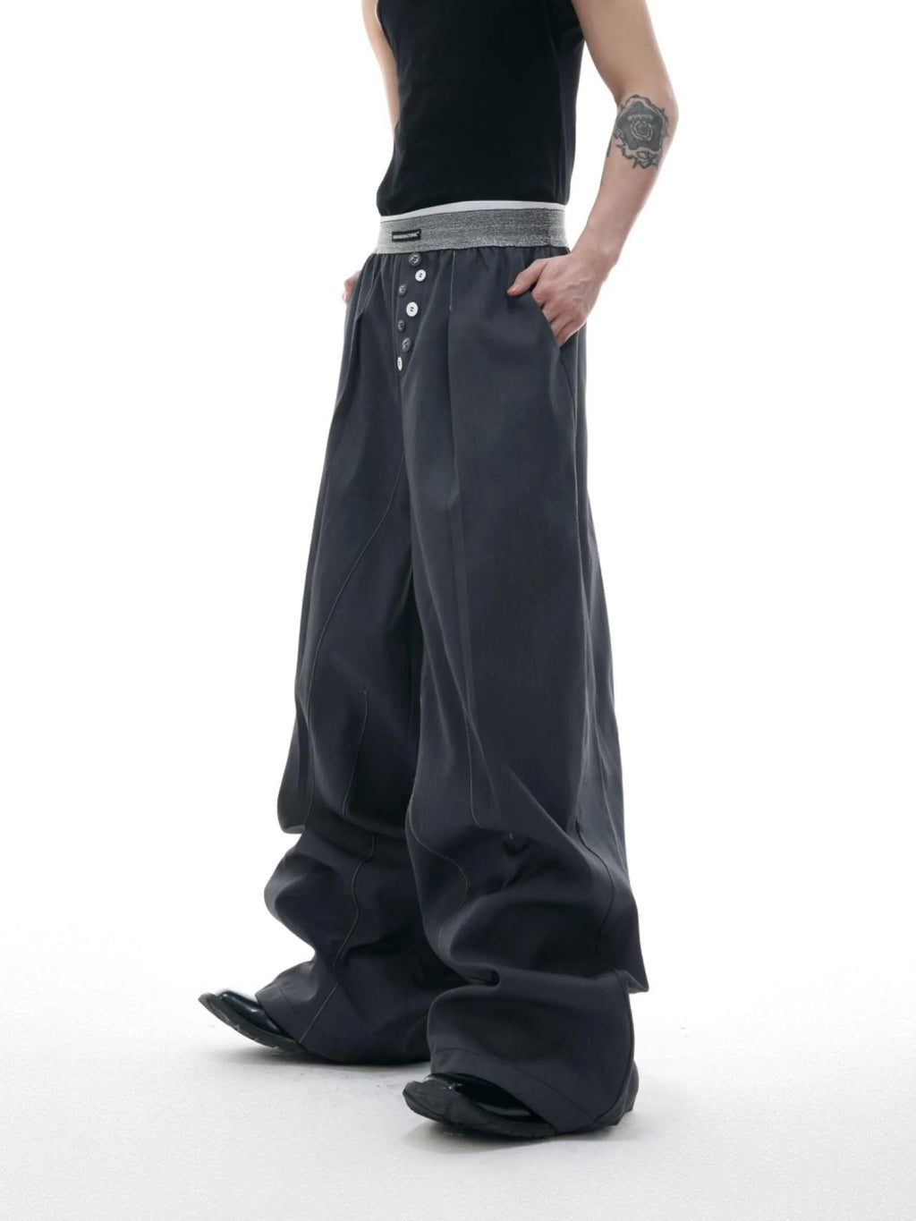 Straight-leg suit trousers in black with high waist and button-open line design, made from polyester-cotton blend.