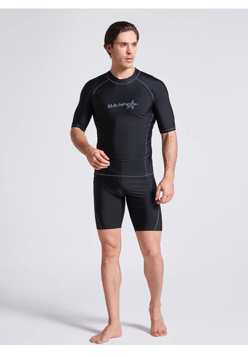 Men's blue quick-dry nylon two-piece swim set with half-sleeve top and swim pants laid flat