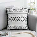Bohemian National throw pillow in light grey colour with 30x50cm rectangular shape on living room sofa