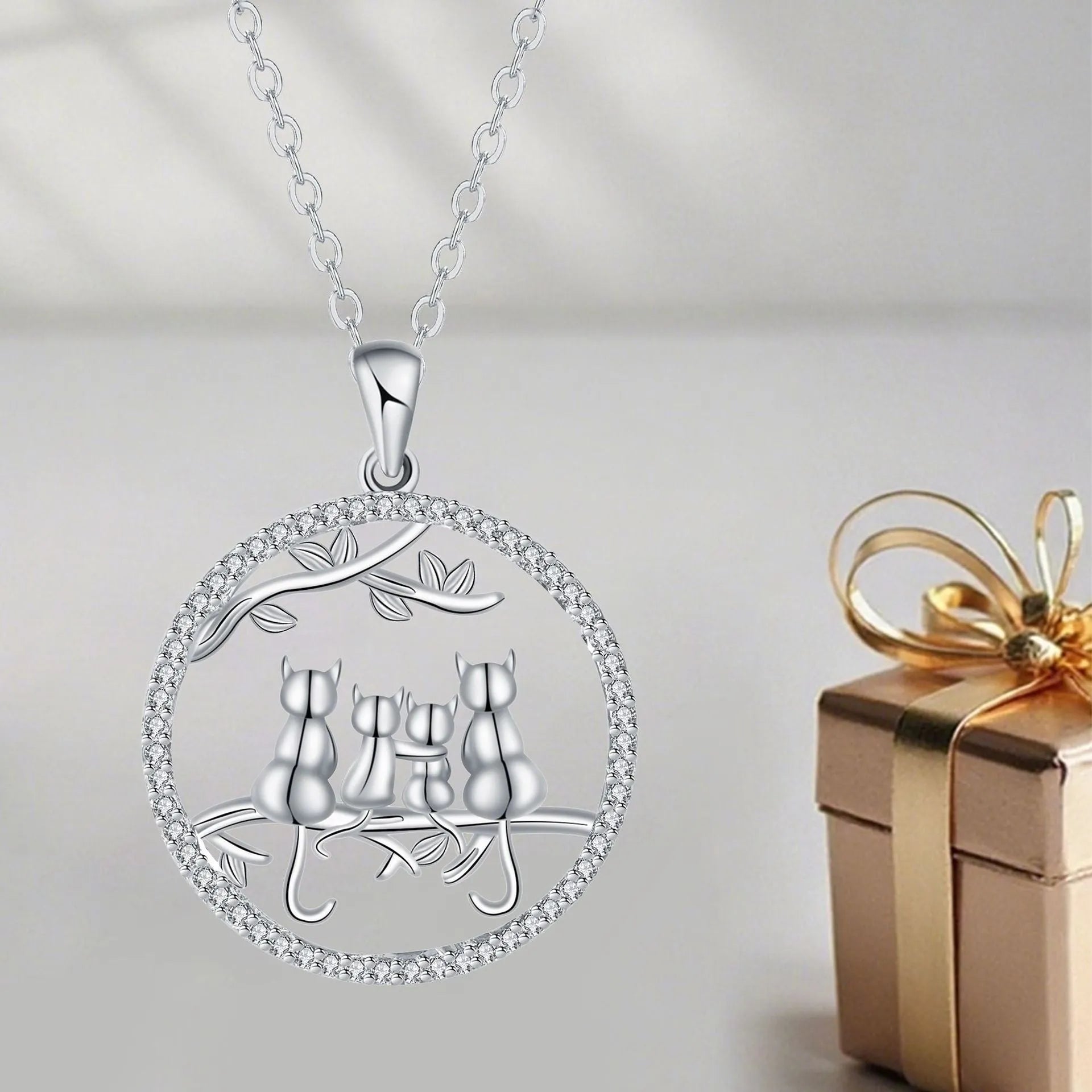 Original design copper cat pendant necklace with a cross chain, featuring a four kitten pattern.