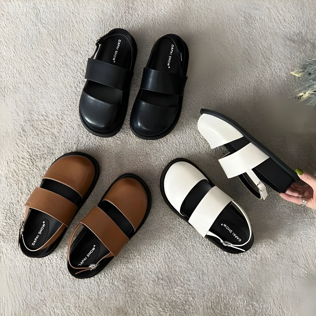 Retro raised sole sandals with ankle-strap buckle in black microfiber