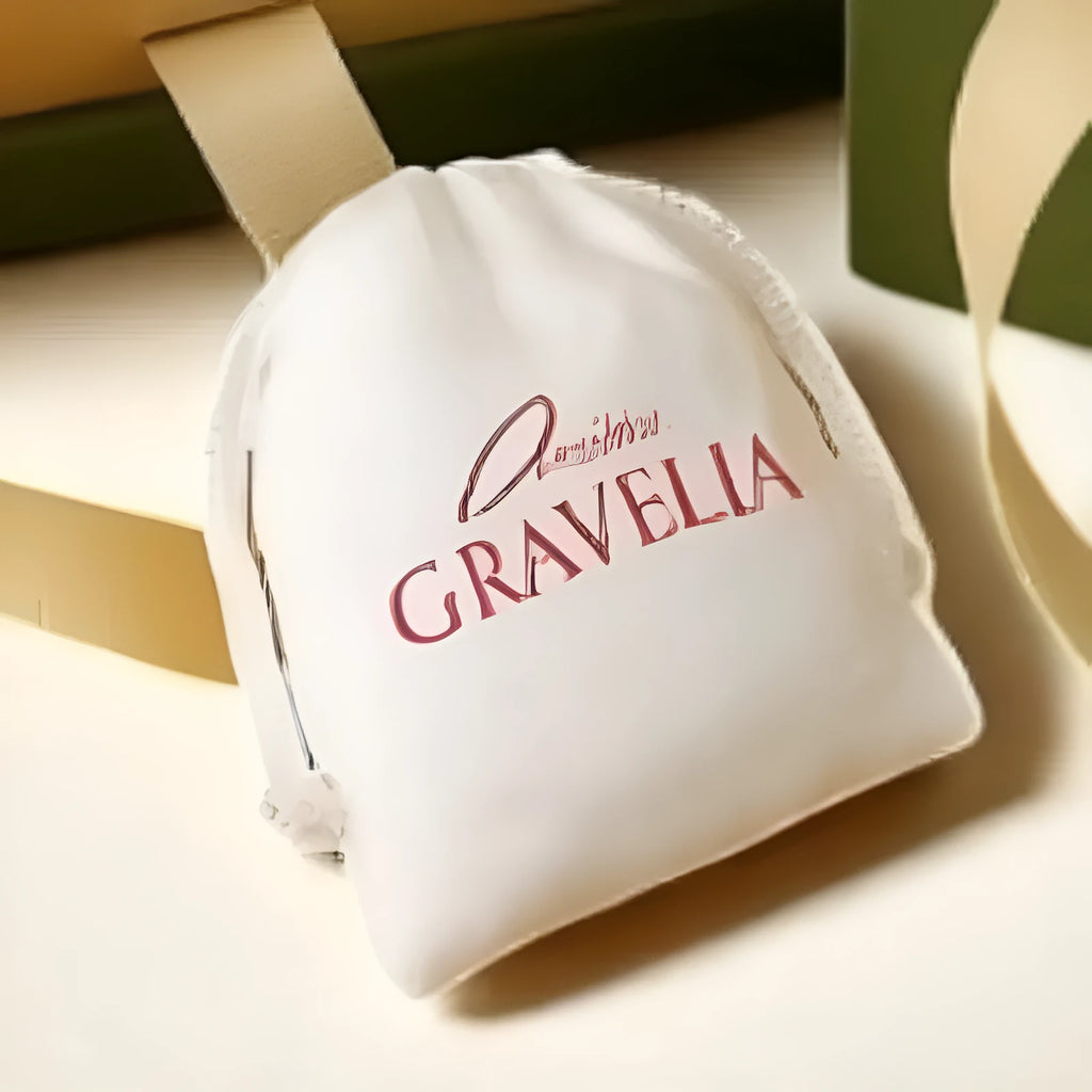 White small cloth drawstring jewellery bag with flocked fabric, measuring 12cm by 15cm.
