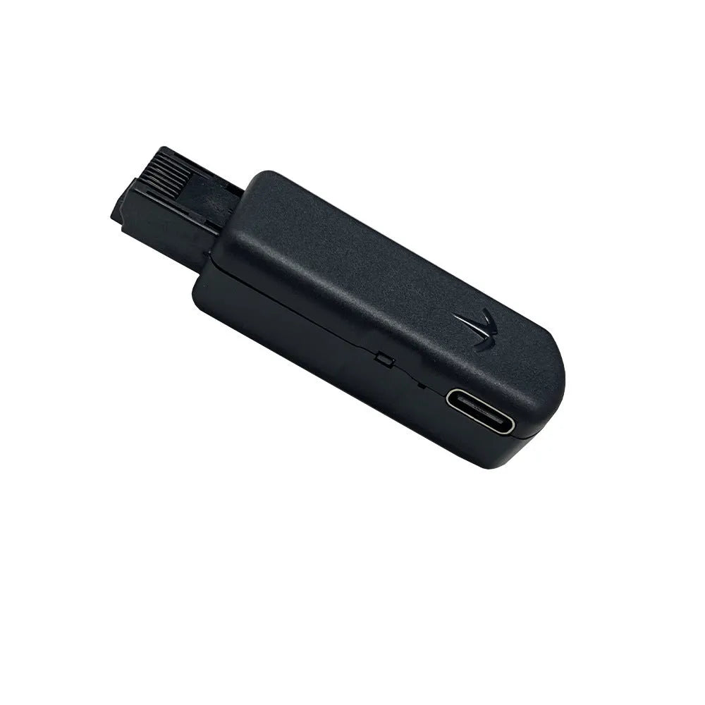 Black JB Tool USB adapter for PlayStation 4 system version switching with Ethernet port.