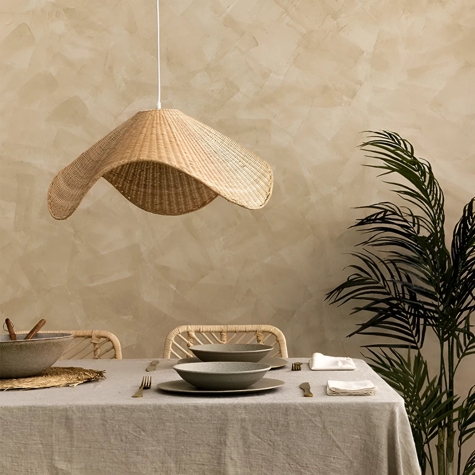 Handmade natural rattan and willow chandelier with warm LED light in three size options.