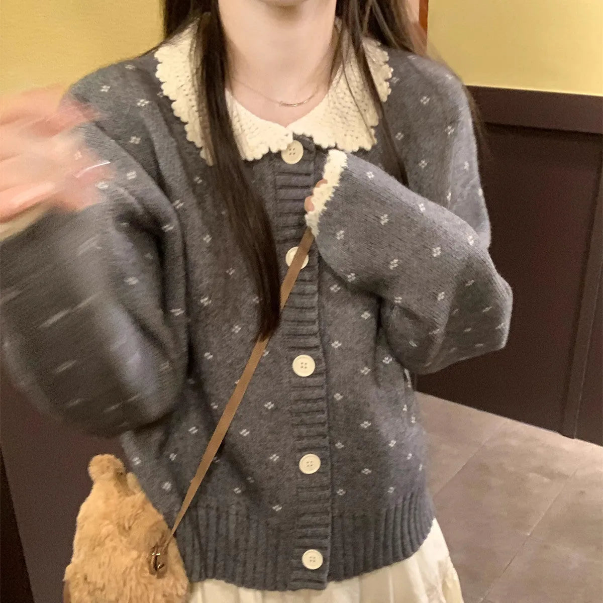 Retro floral Peter Pan collar knitted cardigan coat in grey, shown with button fastening.